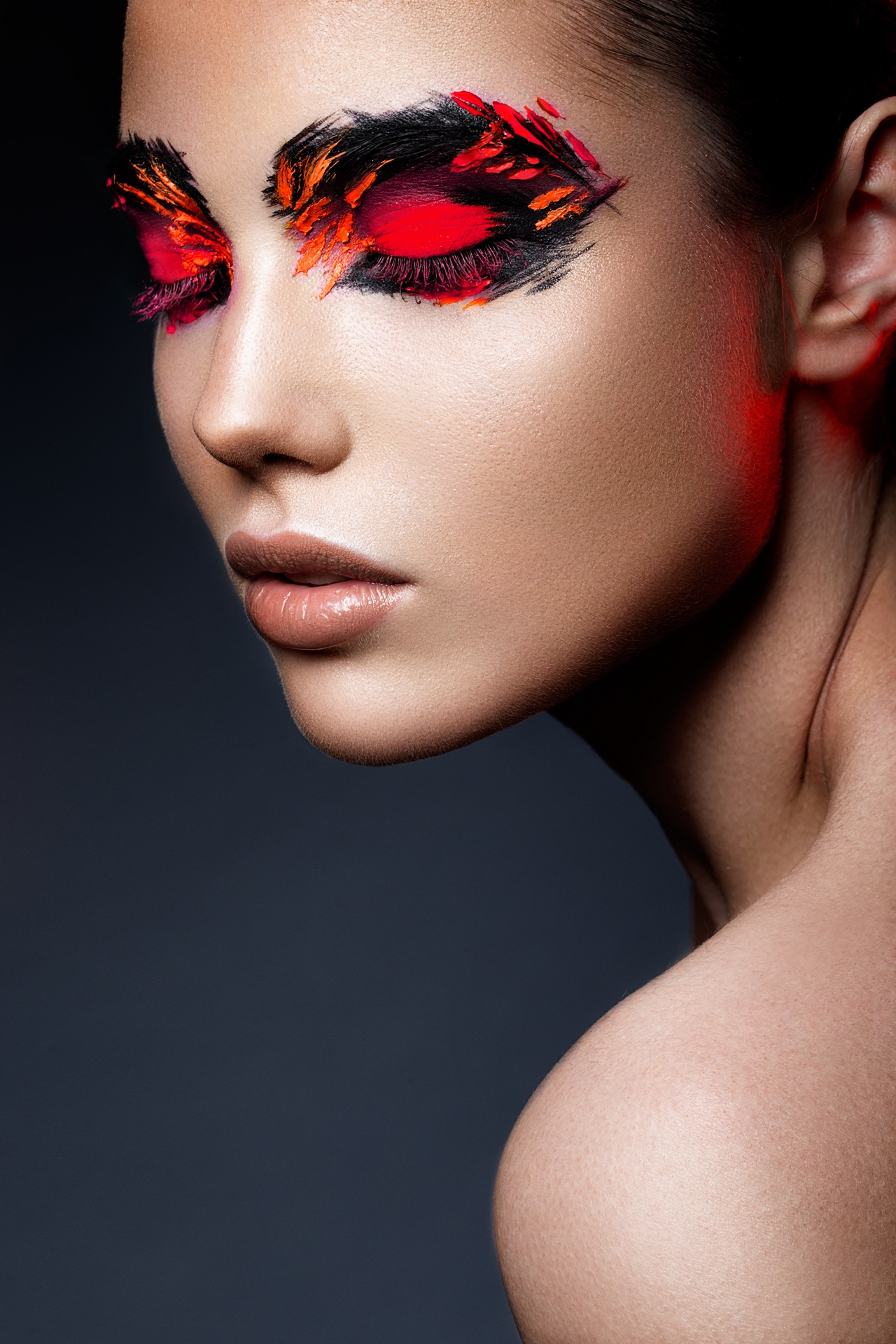 Commercial beauty campaign portrait with red and black editorial makeup